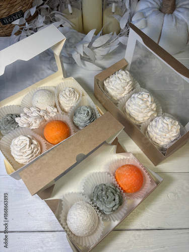 Homemade marshmallows in gift boxes. In festive twilight. The work of a marshmallow manufacturer entrepreneur.