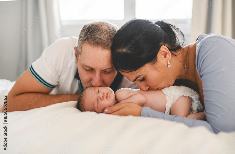 Fototapeta premium family couple with cute newborn baby indoors