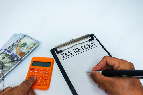 Tax Return Concept with Calculator, Pen, and Money