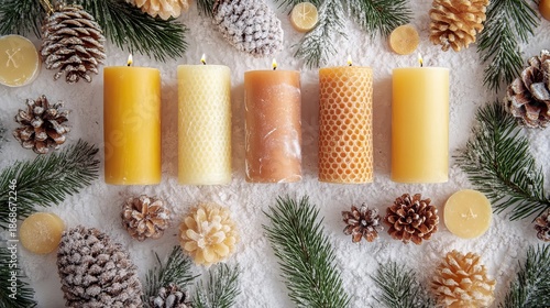 Beeswax candles and pinecones on snowy background. Christmas craft activity, creative DIY project for kids, craftwork, eco friendly, sustainable concept.