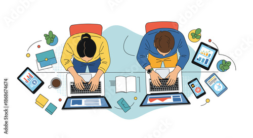 Overhead view of two office professionals working on laptops at a shared desk with business data charts and coffee cups.