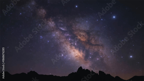 Milky way galaxy on a clear night sky with mountain silhouette