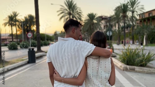 Wallpaper Mural Romantic couple walking and hugging at sunset Torontodigital.ca