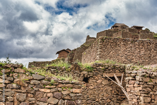 Stone walls inca ruins overlooking the Sacred Valley along the terraced slopes of the Pisac archaeological site in Peru.