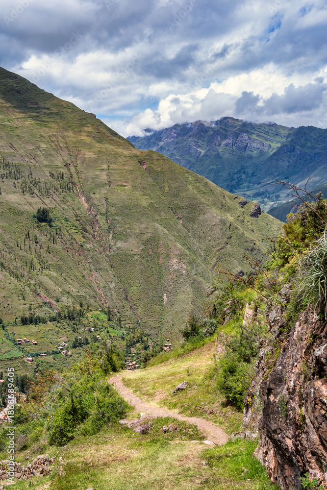 Fototapeta premium Scenic view with the agricultural stone terraces built on the steep mountainside at the ancient Inca archaeological site of Pisac, in the Sacred Valley of Peru