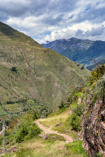 Scenic view with the agricultural stone terraces built on the steep mountainside at the ancient Inca archaeological site of Pisac, in the Sacred Valley of Peru