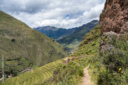 Scenic view with the agricultural stone terraces built on the steep mountainside at the ancient Inca archaeological site of Pisac, in the Sacred Valley of Peru