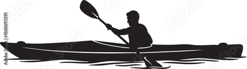 Silhouette of a person kayaking in a canoe on water