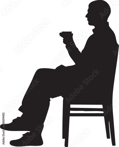 Silhouette of a person sitting on a chair holding a cup