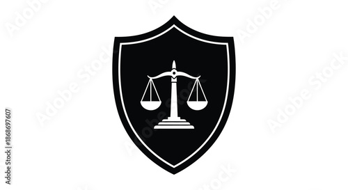 A striking black shield emblem displaying a balanced scale of justice presented as a silhouette