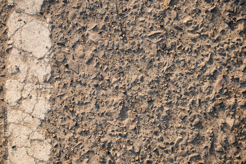 Rough Asphalt Pavement Texture with Faded White Painted Road Marker Line