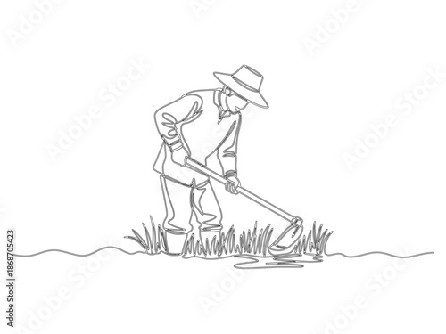 A farmer is hoeing in the rice field_26