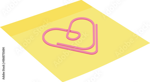 Pink heart shaped paperclip on yellow sticky note.