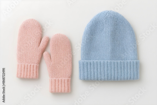 Winter Mittens and Wool Hat Flat Lay in Pastel Colors on White Background
