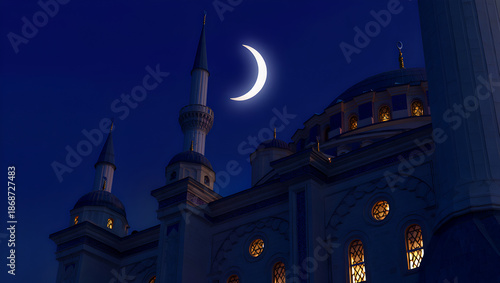 Crescent Moon Over Illuminated Mosque at Night