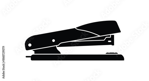 A striking black silhouette of a common office stapler showcasing its functional design silhouette
