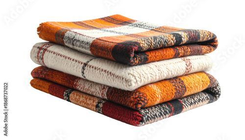 Stack of four folded, plaid blankets with autumn color schemes