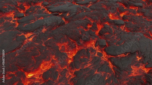 Aerial view of molten lava flowing across a dark rocky landscape
