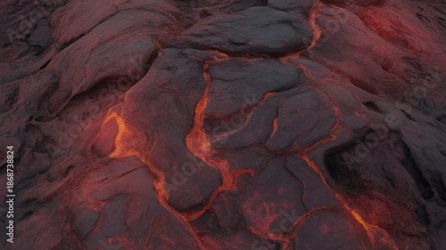 Aerial view of molten lava flowing across a rugged volcanic landscape