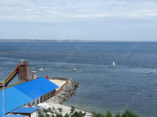 A sea pier on background of blue sky.