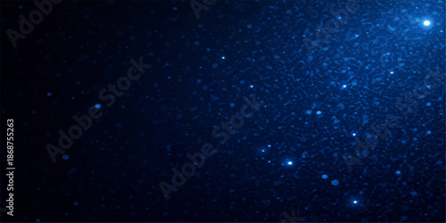 Abstract motion background of falling stars and snowflakes loop across a dark blue starry galaxy and cosmic winter sky filled with light particles and nebula dust