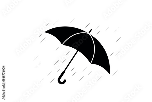 A black umbrella on a rainy day with raindrops falling around it