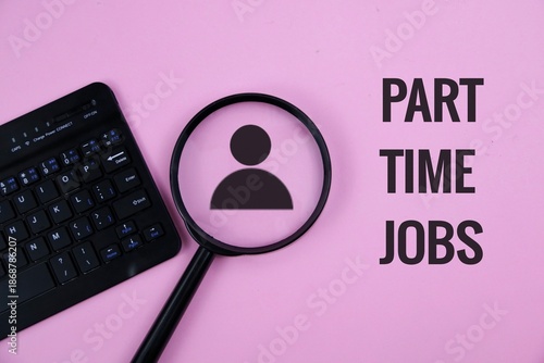 Pink background with a keyboard, a magnifying glass revealing a user silhouette, and the words Part Time Jobs. Evokes job searching, hiring, career opportunities, and professional growth.