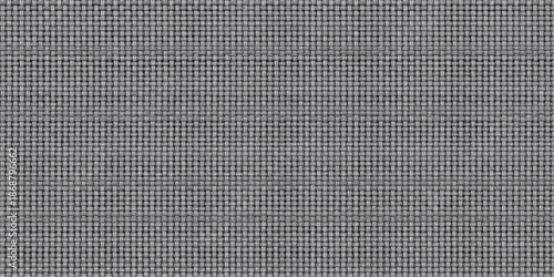 A seamless closeup of gray and black fabric texture with black leather material featuring a rough woven textile pattern on a dark cotton surface backdrop