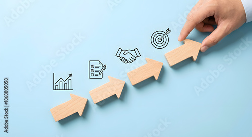 Wallpaper Mural business growth concept with wooden arrows and hand Torontodigital.ca