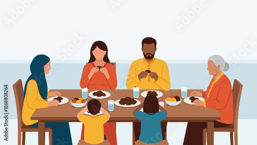 Diverse family enjoying a meal together at a dining table.