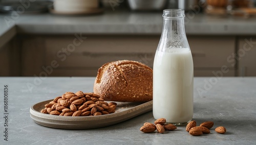 Milk and Almonds Next to Bread on a Kitchen Table in Morning Light