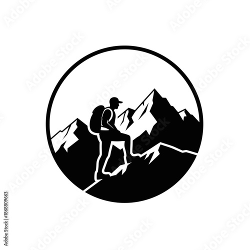 Man hiking on mountain peak summit.