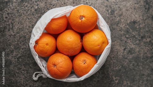 Fruit Basket With Red and Orange Citrus Fruits Arranged on a Dark Surface