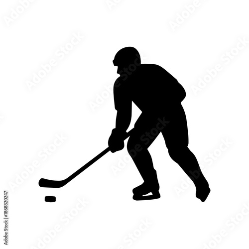 Ice hockey player silhouette dribbling puck with stick