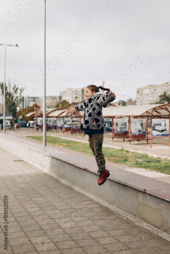 little girl jumping