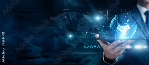 Photos Businessman using the tab and analyzing business cooperation data, partnership s