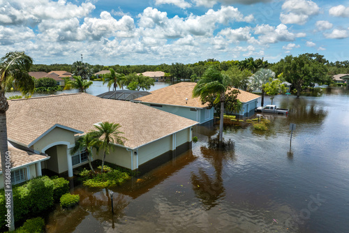 Wallpaper Mural Tropical rainstorm flooded residential homes in suburban community in Florida. Hurricane aftermath Torontodigital.ca