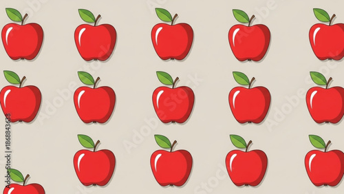 Vibrant red apples with green leaves on beige background