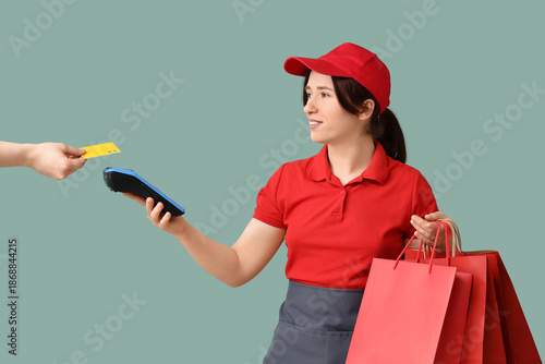 Female cashier with shoppin...