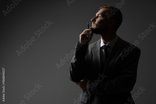 Silhouette of thoughtful bu...