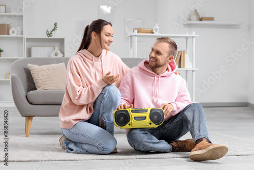 Young couple with boombox s...