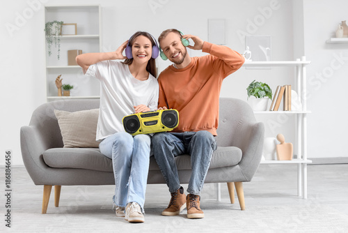 Young couple in headphones ...