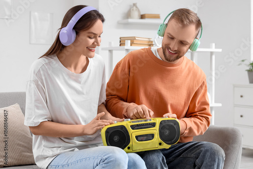 Young couple in headphones ...