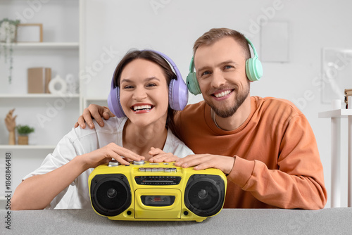 Young couple in headphones ...