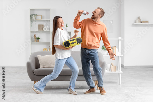 Young couple with boombox a...