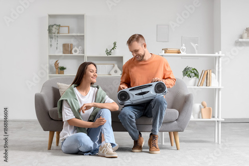Young couple with boombox s...
