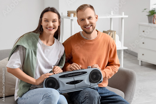 Young couple with boombox s...