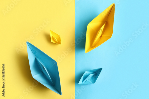 Different paper boats on co...