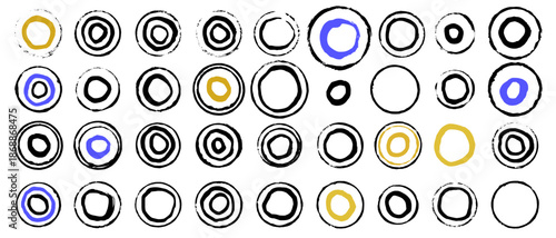 Abstract hand-drawn ink circles, rings pattern with yellow and blue accents on white background. Vector elements in casual, sketchy manner, reminiscent of stamp impressions or brush strokes. 