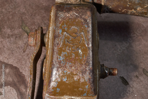 Vintage metal hand drill with wooden elements and visible wear. Traditional manual drilling tool representing craftsmanship, repair work, and historical technology.